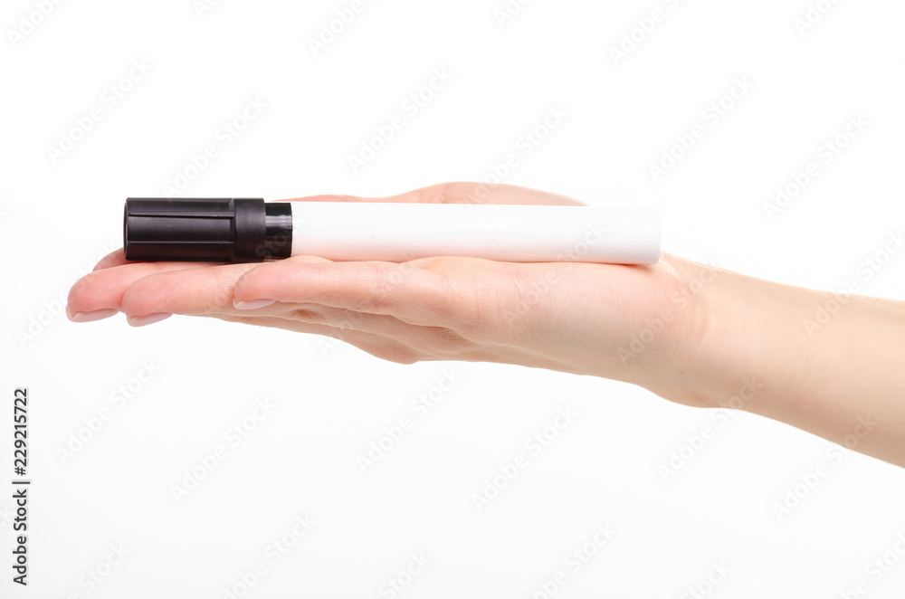 Black marker in hand on a white background. Isolation Black marker in hand on a white background. Isolation