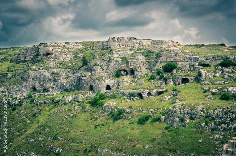 View of canyon with rocks and caves Murgia Timone, Matera Sassi, Italy