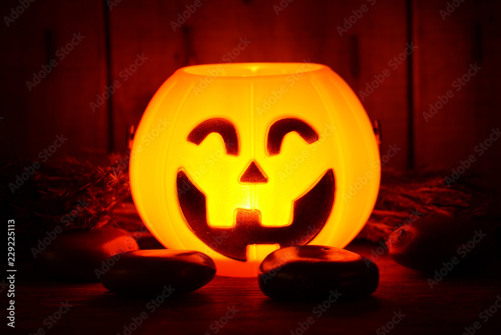 Fototapeta premium Light growing on pumpkin smile decorate for halloween night have space for idea