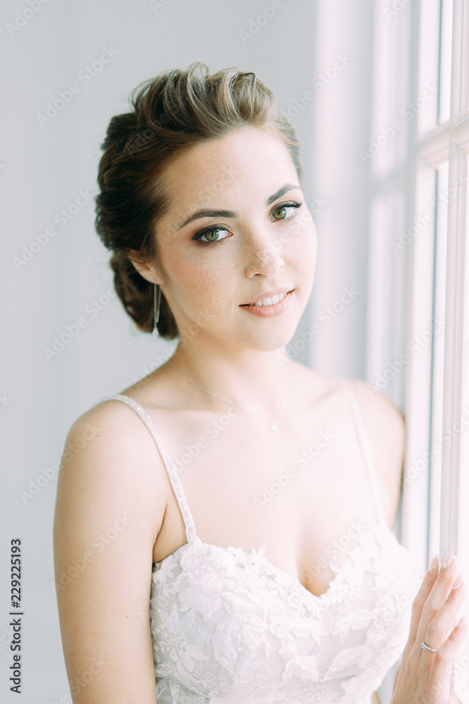 Beautiful bride in a white Studio. Russian wedding in St. Petersburg. Portrait and details in fine art style. Beautiful bride in a white Studio. Russian wedding in St. Petersburg. Portrait and details in fine art style.
