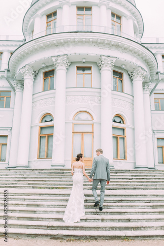 Stylish wedding in St. Petersburg. Russian wedding in the European style in the city. The castle and the architecture curve for the photo shoot.