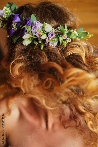 bride with red hair and wreath from flowers