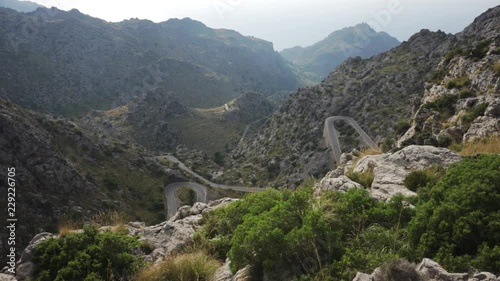 Narrow curved roads to Port de Sa Calobra in Mallorca, Spain photo