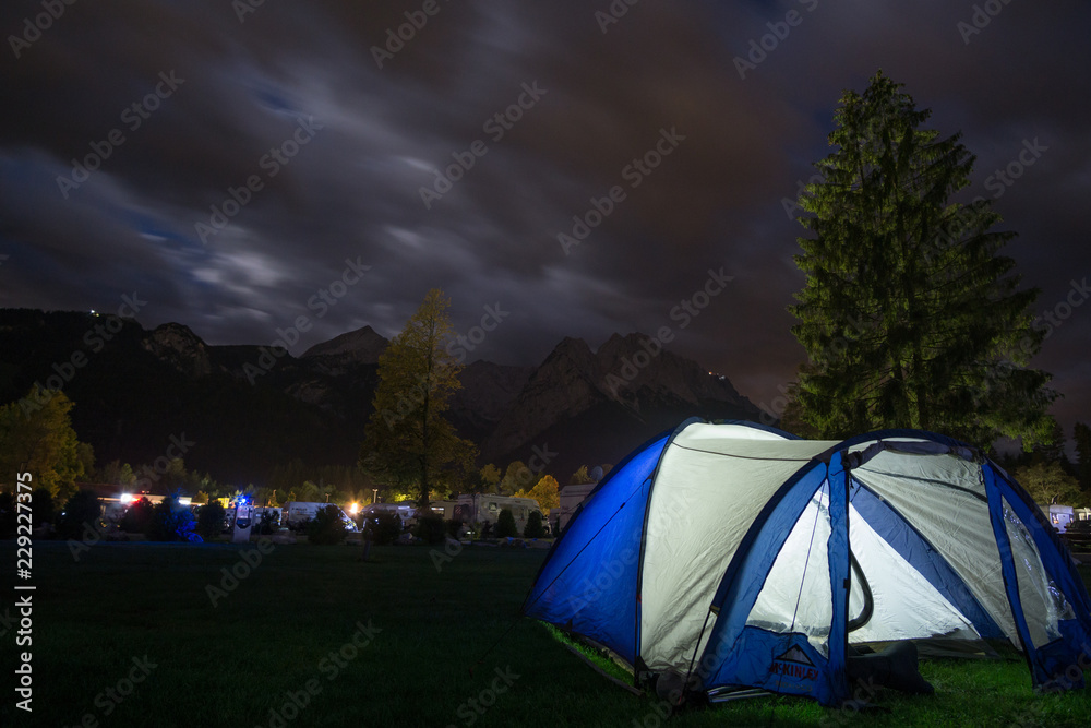 Tent before alps at night