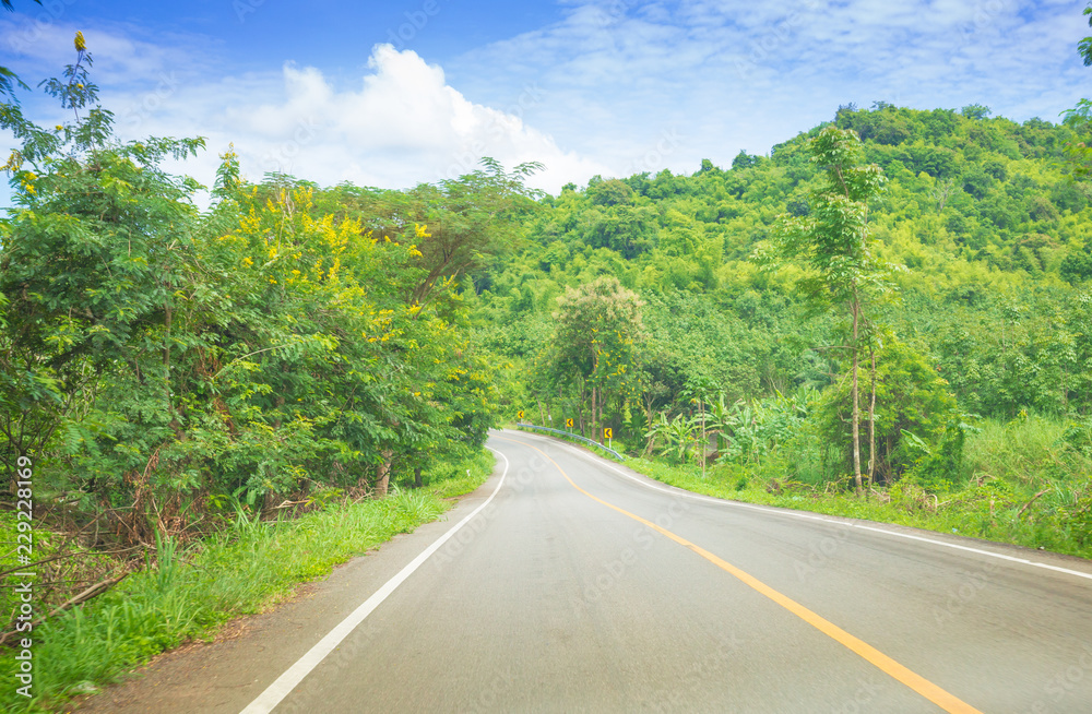 Fototapeta premium Road to the nature on a bright day, Road to advanture background concept
