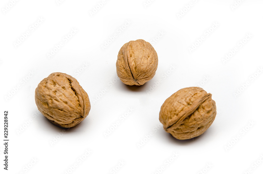 three walnuts on a white background, isolated three walnuts on a white background, isolated