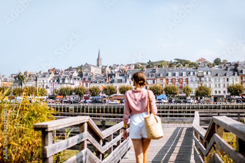 Woman enjoying great view on the beautiful riverside in Trouville city, famous french resort in Normandy © rh2010
