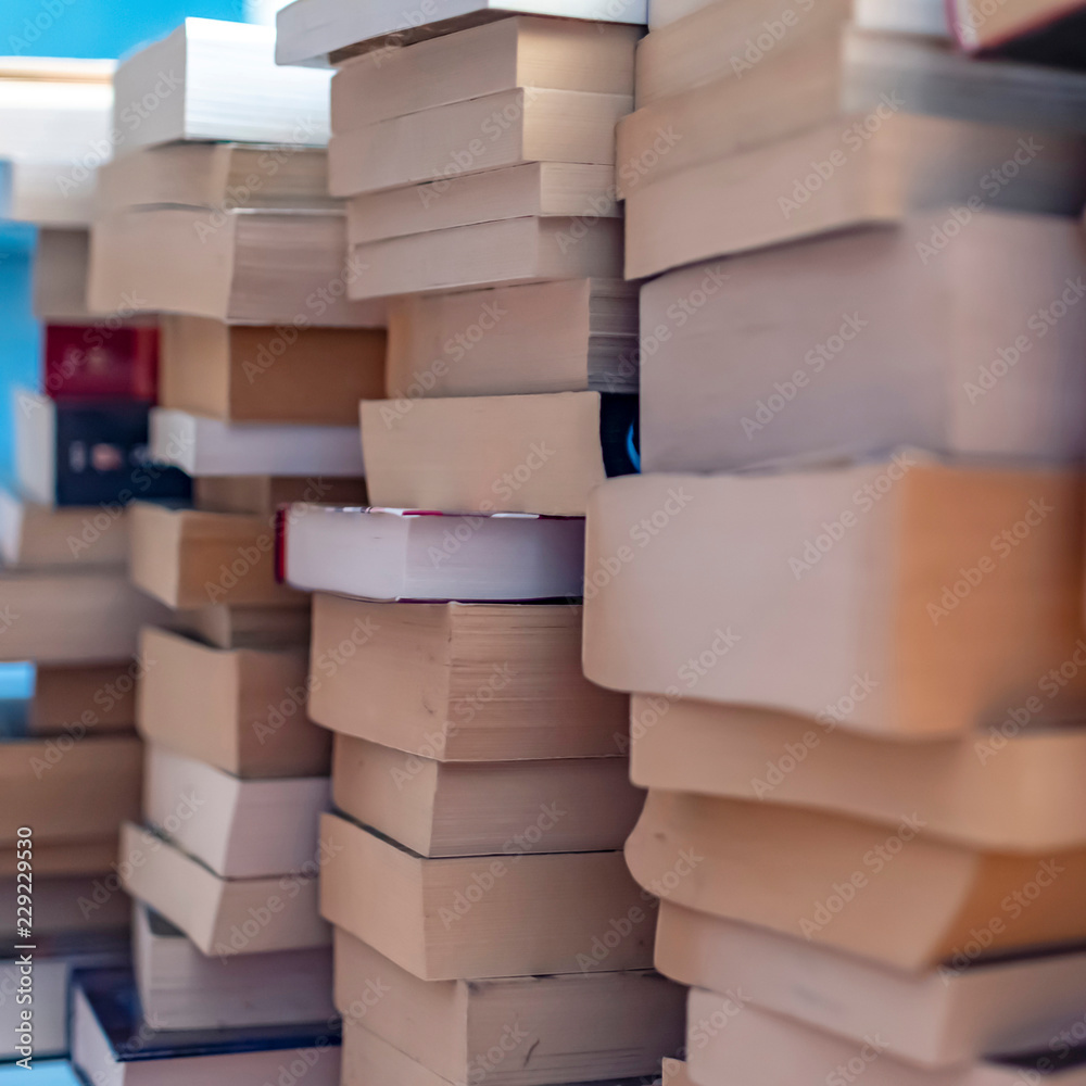 Many used and stacked books that were sorted out after reading. Many used and stacked books that were sorted out after reading.