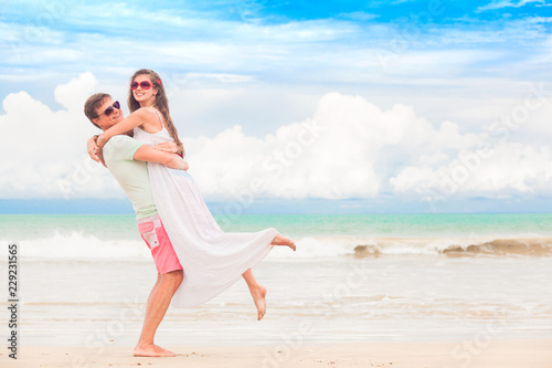 happy young couple walking and having fun by the beach. Khao Lak, Thailand