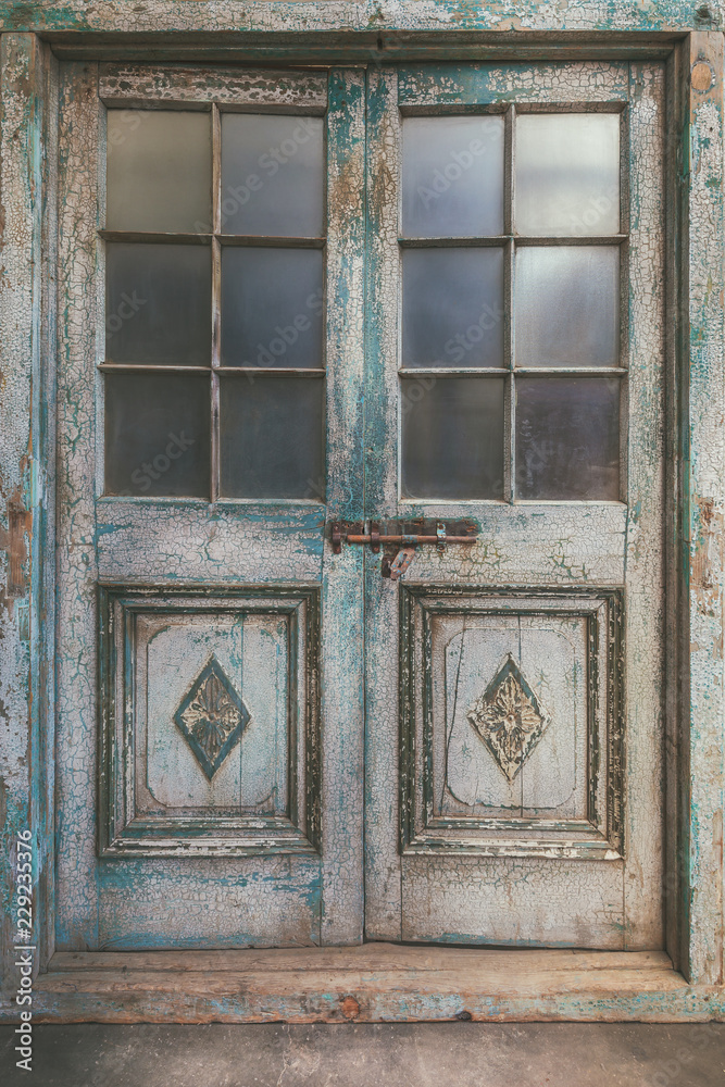 Ancient weathered double entrance door