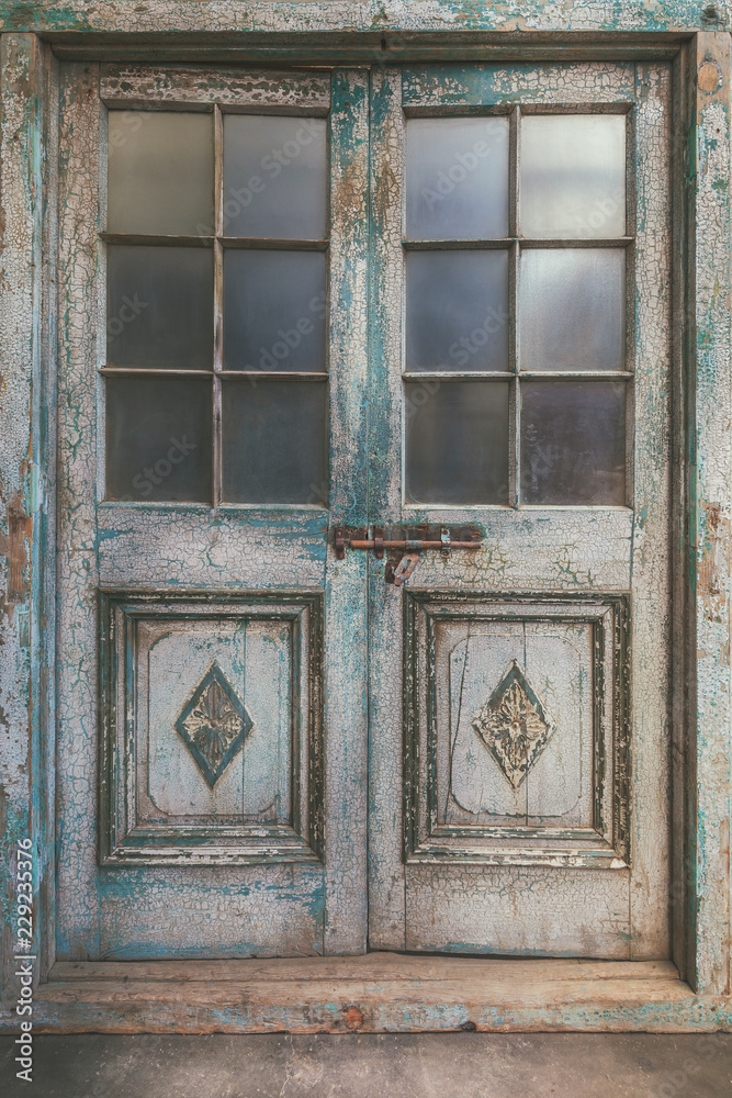 Ancient weathered double entrance door Ancient weathered double entrance door