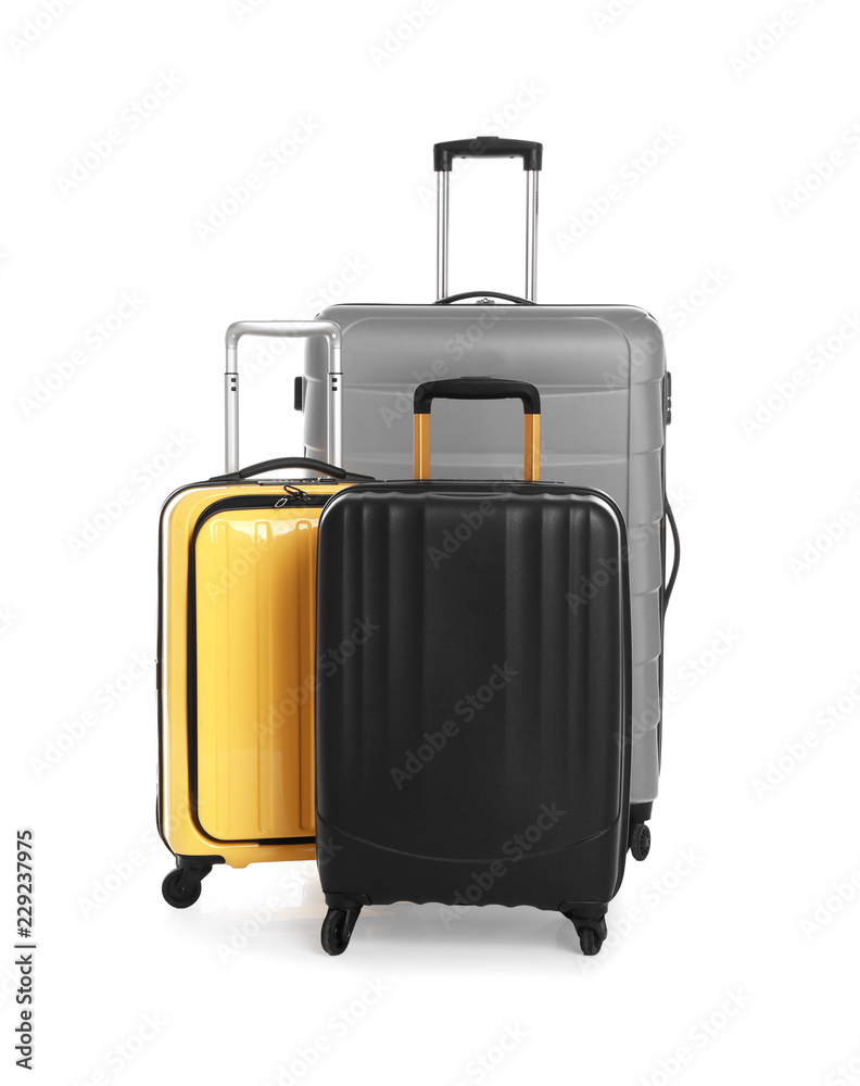 Modern suitcases for travelling on white background Modern suitcases for travelling on white background