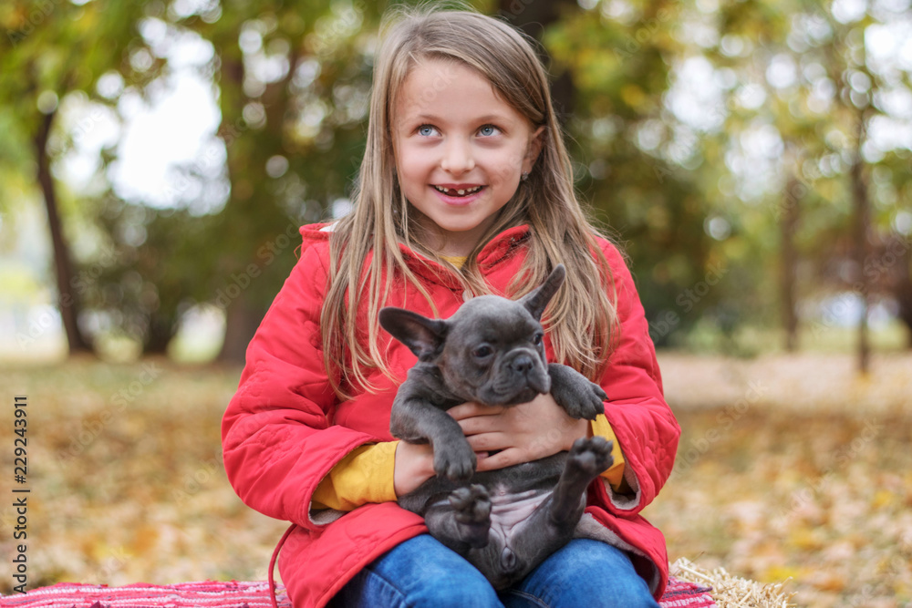 Little girl with Buldog puppy Little girl with Buldog puppy
