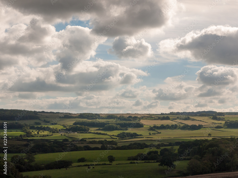 dorset corfe castle field view green landscape open summer day clouds weather clear nature village