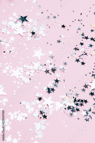 Silver sparkles on pink background