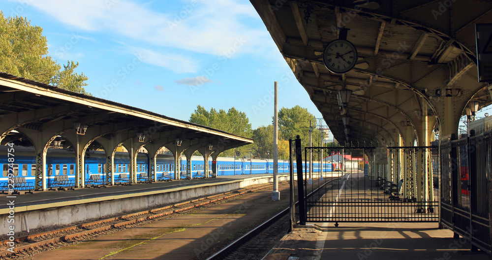 Obraz premium Architecture of Old City Train Station with No Passengers and No Trains. Vintage Style Image of Empty Old Platform at Railway Station, Main Transportation Stop in St. Petersburg, Russia