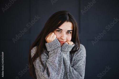 Emotions, feelings and face expression. Playful coquettish flippant childish woman portrait on dark background. photo