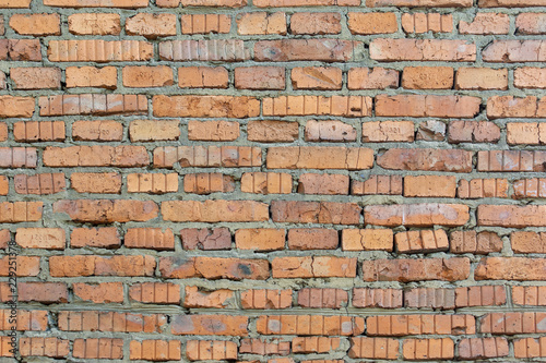 Wall of orange bricks. Background with brickwork texture.