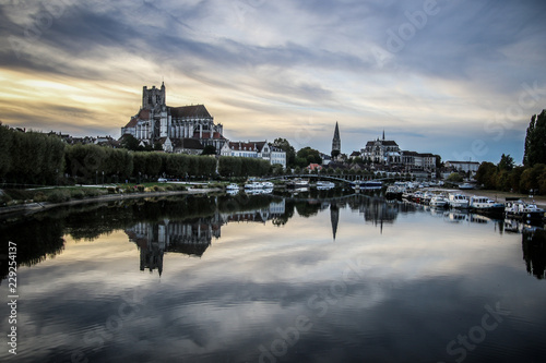 Auxerre, French city with cathedral and river at night