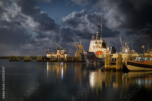 Ships in the harbor of West-Terschelling, an island in the wadden sea photo