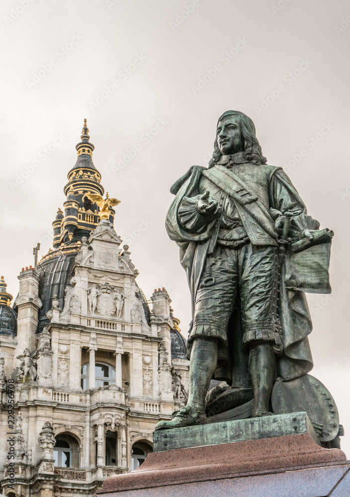 Statue of Flemish painter David Teniers the Younger against one