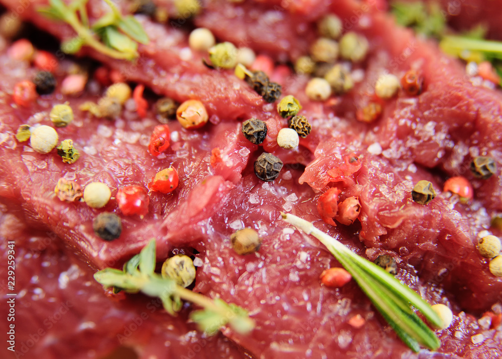 raw beef fillet with pepper and thyme, ready to grill. raw beef fillet with pepper and thyme, ready to grill.