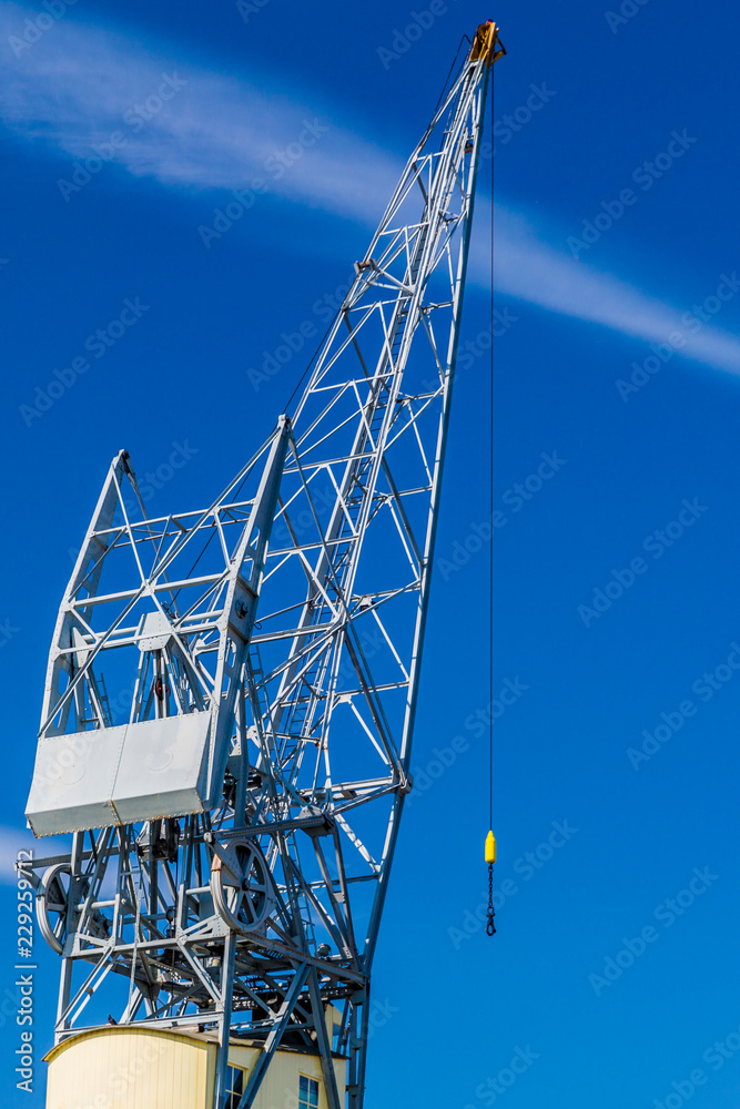 image of a part of a crane with a blue sky background image of a part of a crane with a blue sky background
