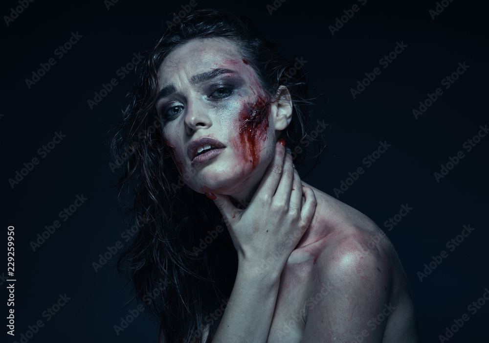 Beautiful girl with a scar on her face in the blood Beautiful girl with a scar on her face in the blood