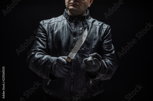Schilderij op canvas Serial killer maniac with knife and black gloves