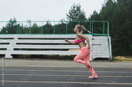 Athlete at the start of the stadium treadmill