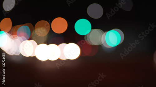 City street bokeh lights moving in the distance for green screen © rocketclips
