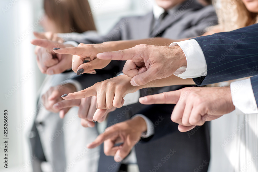 side view. hands the business team pointing at you side view. hands the business team pointing at you