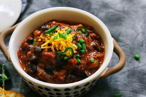 Homemade Beef Chili topped with Cheddar cheese and green onions