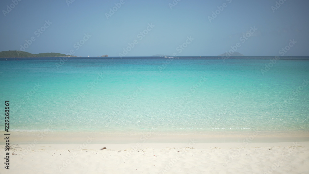 Background Plate of Blue water and white sand on a Caribbean beach