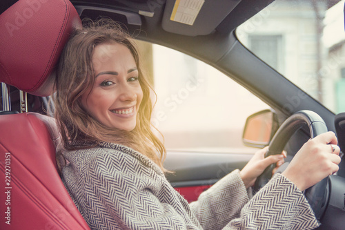 Young woman driving a car