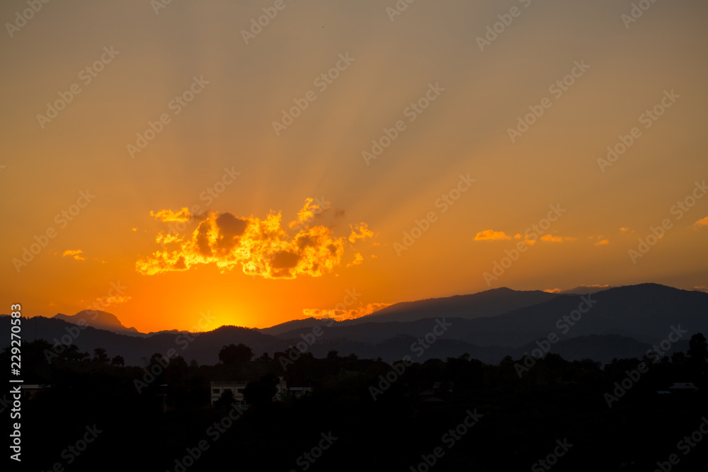 Blue and orange sunset sky with rays of sun. Natural landscape for background. soft and blur style for background.In New Year 2019.Sun rise, sunlight, sunbeam, sunshine, Naturally beautiful.