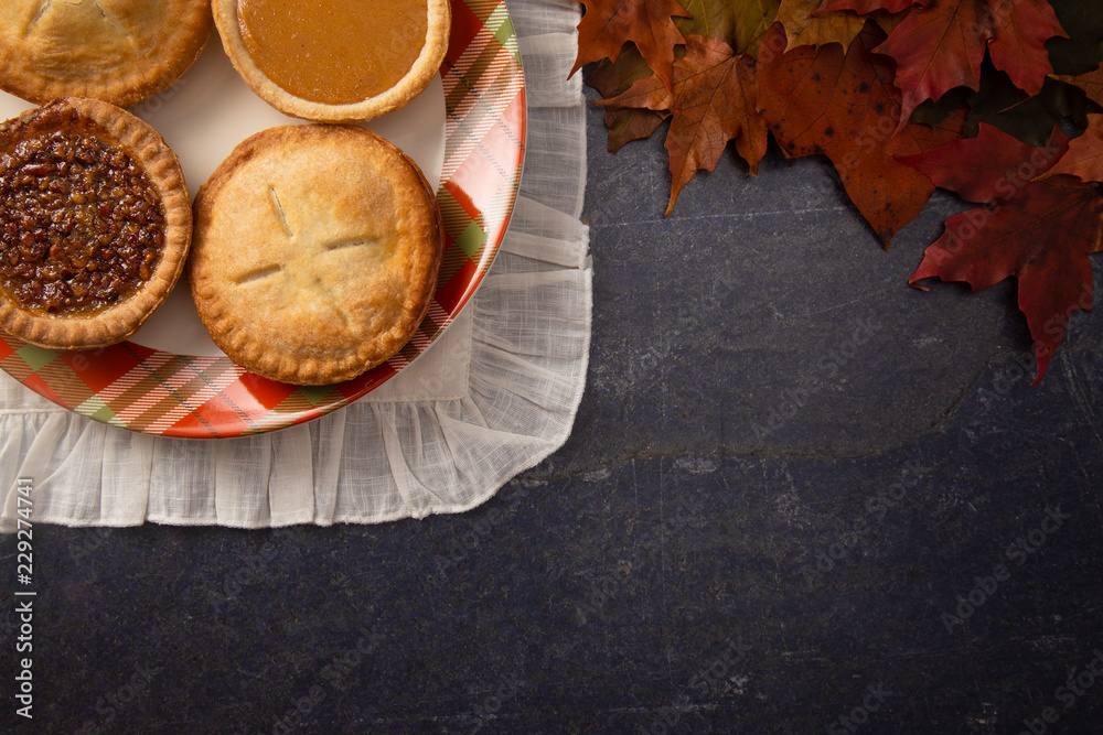 Holiday Table Set with Various Flavors of Fresh Baked Pies Holiday Table Set with Various Flavors of Fresh Baked Pies