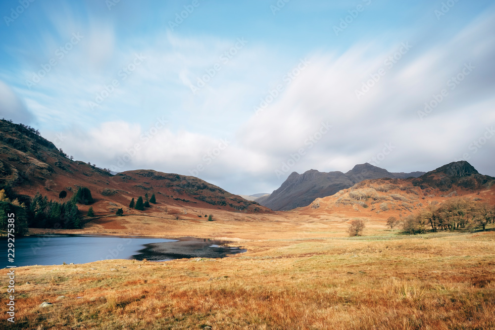Blea Tarn with Langdale Pike beyond. Cumbria, UK. Blea Tarn with Langdale Pike beyond. Cumbria, UK.