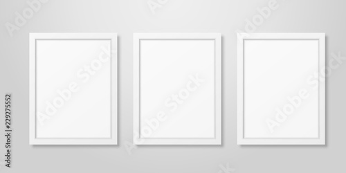 Three Vector Realistic Modern Interior White Blank Vertical A4 Wooden Poster Picture Frame Set Closeup on White Wall Mock-up. Empty Poster Frames Design Template for Mockup, Presentation