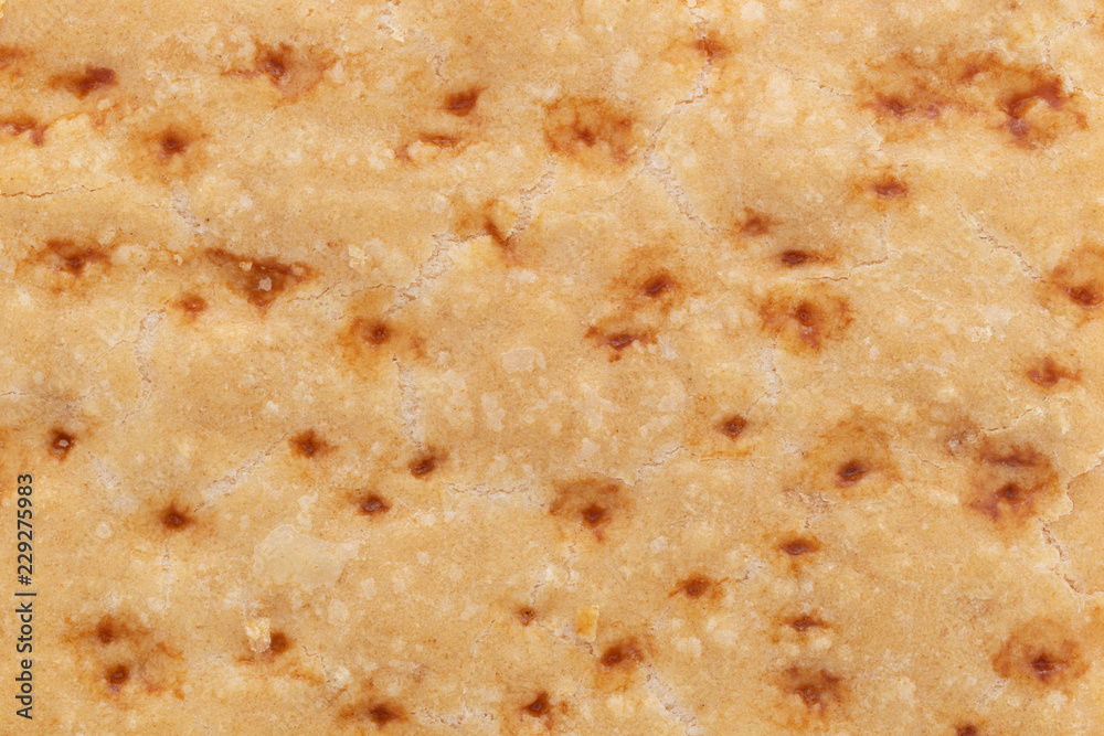 A very close view of the pastry crust of a freshly baked lemon bar. A very close view of the pastry crust of a freshly baked lemon bar.