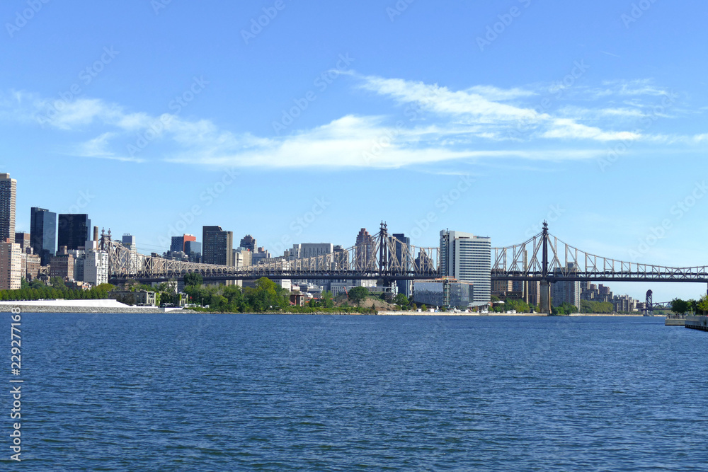 New York City Waterfront, East River and Manhattan Skyline with Queensboro Bridge in background