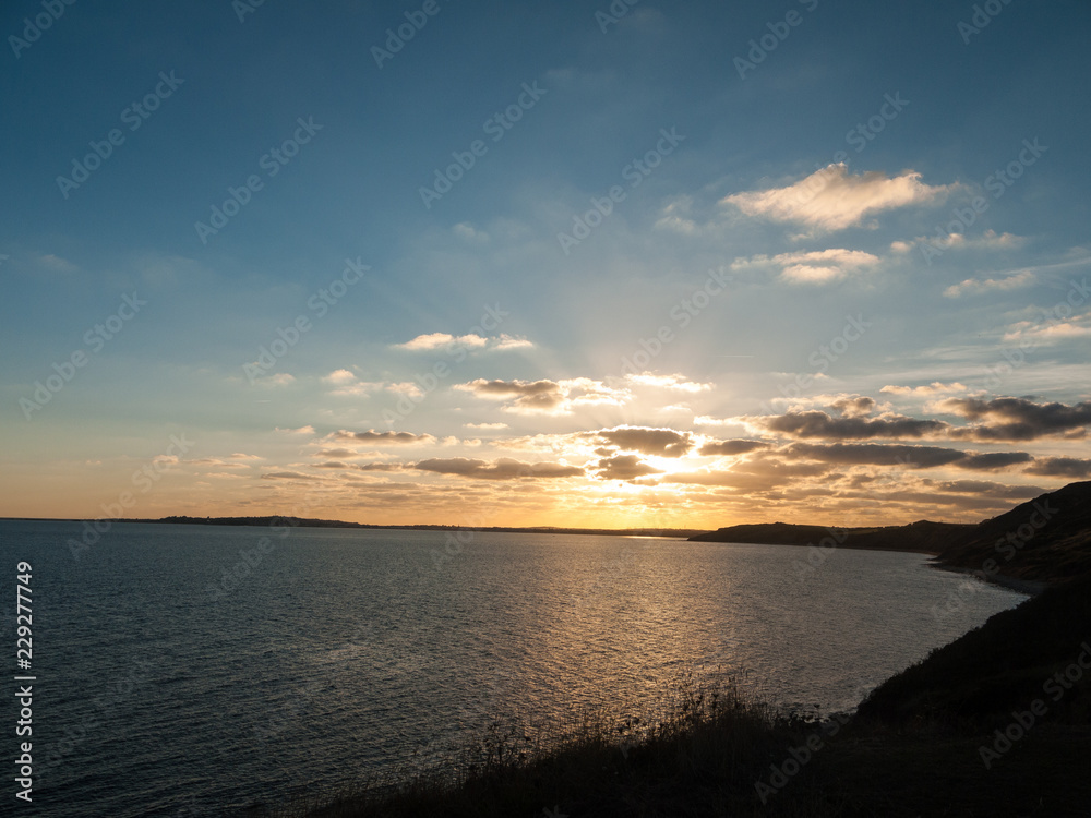 Fototapeta premium beautiful sunset weymouth dorset clouds ocean water sea light landscape nature