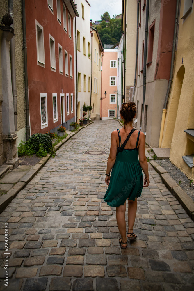 womand walking in an old european street