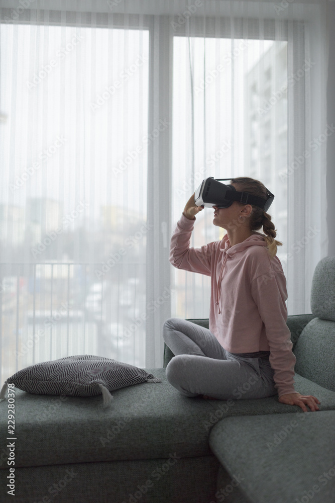 Woman exploring virtual reality at home Woman exploring virtual reality at home