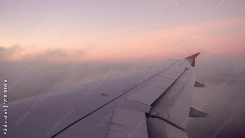 View of a wing of an airplane while is landing in Canada. View of a wing of an airplane while is landing in Canada.