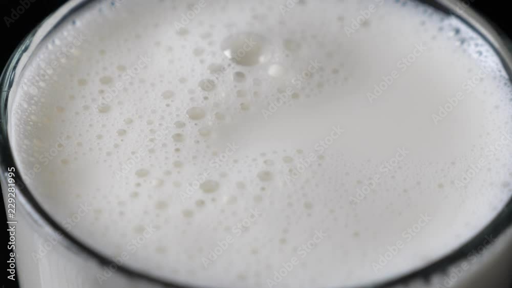 Bubbles in milk in the glass Bubbles in milk in the glass