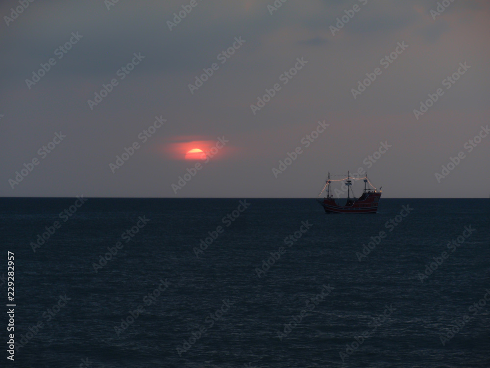 pirate ship at sunset