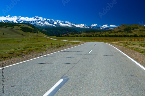 Asphalt road and mountains on the horizon. Chuysky Trakt - M52. Altai, Russia photo