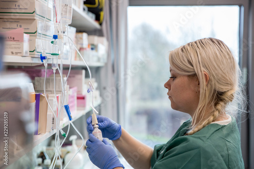 A nurse in a medication room