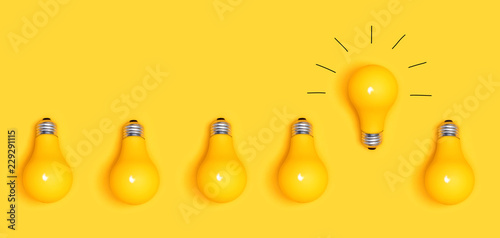 One outstanding idea concept with yellow light bulbs